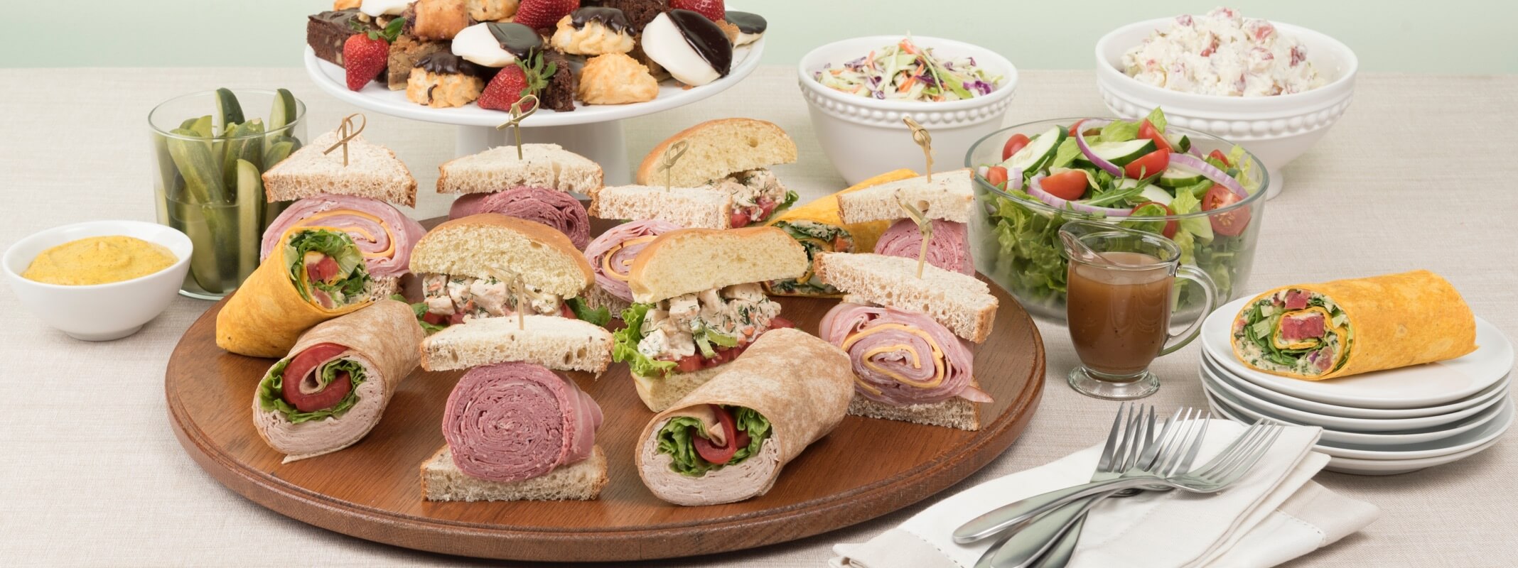 Catering Executive Meeting array of wraps, salads, sides, and desserts
