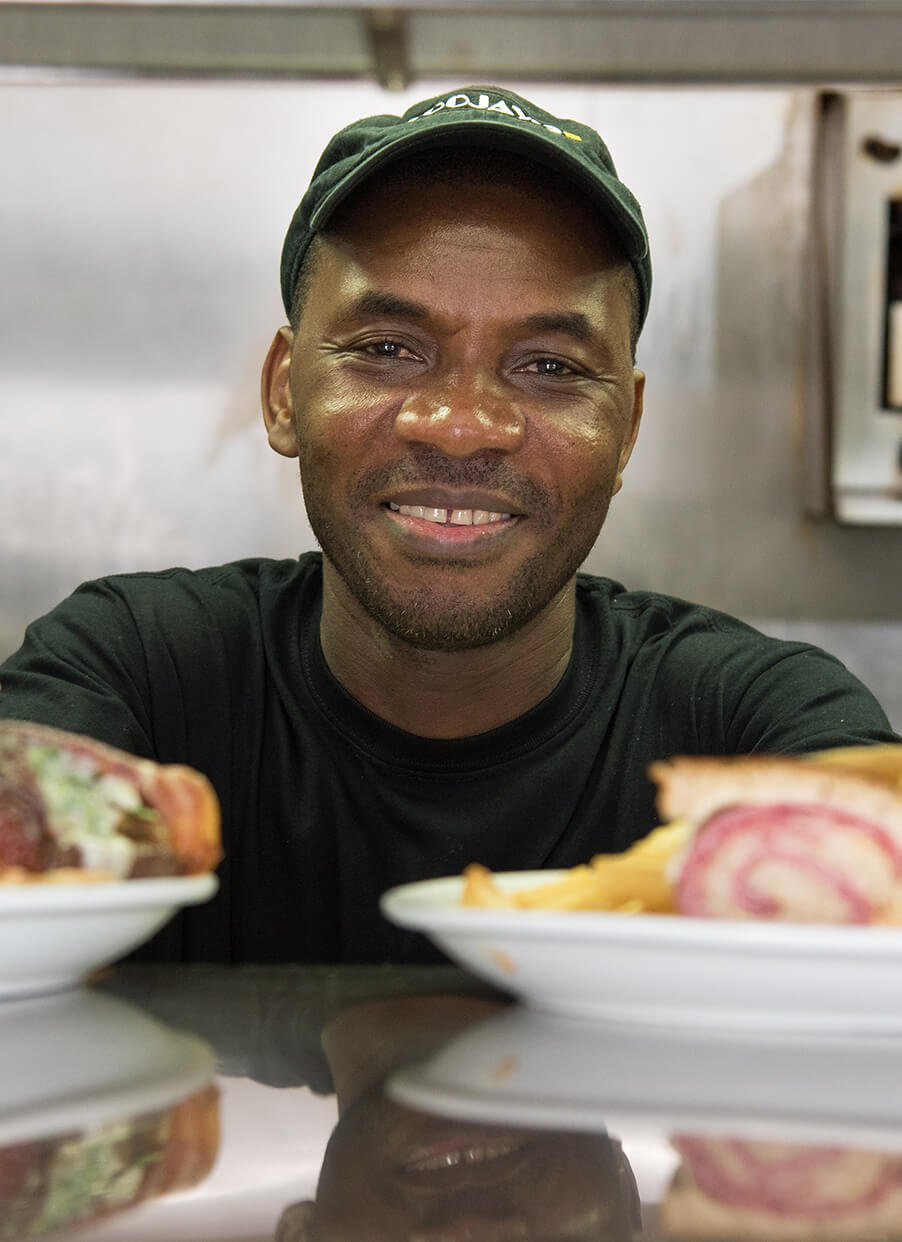 TooJay's line cook serving up dishes