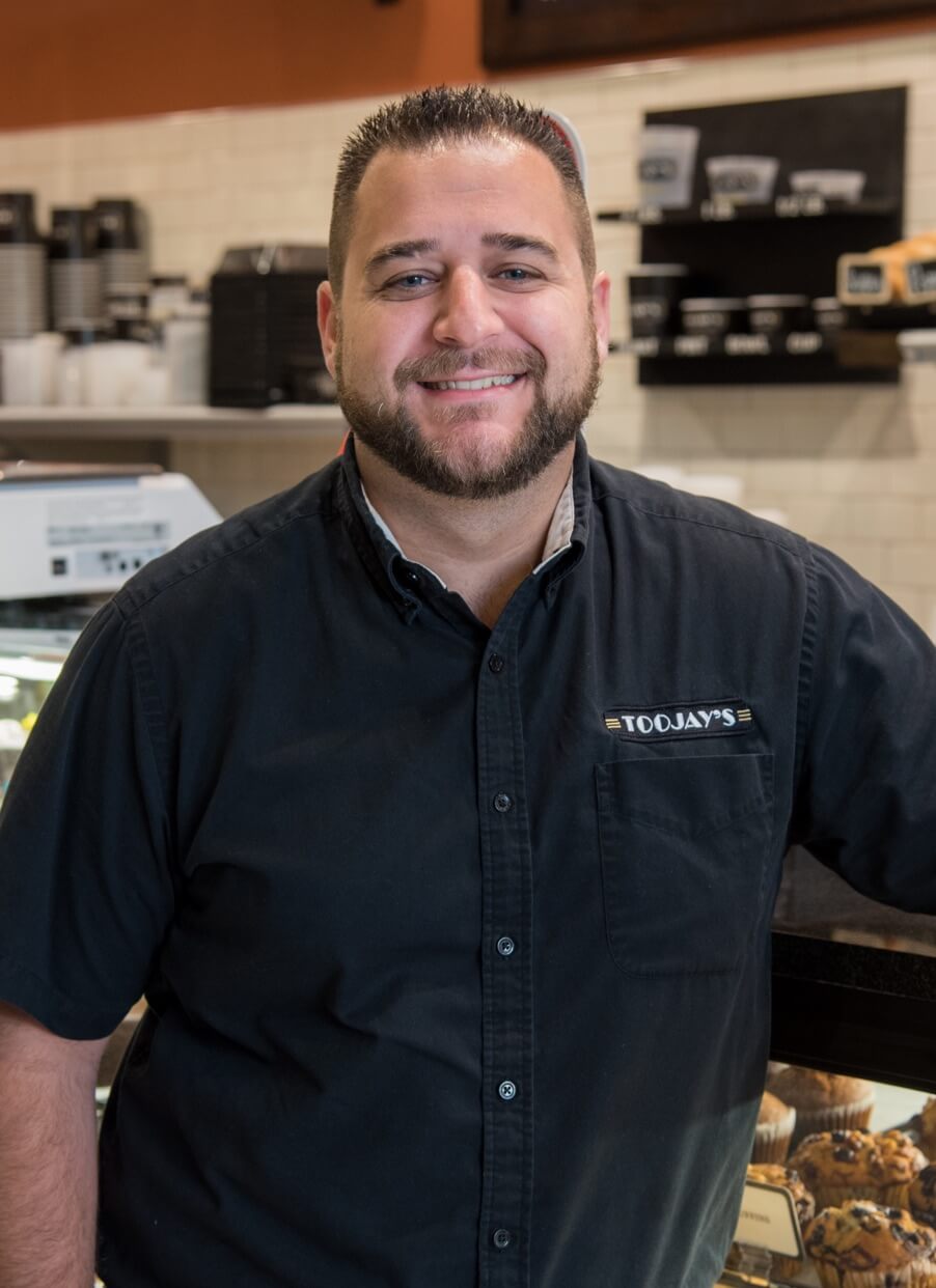 Male TooJay's employee smiling