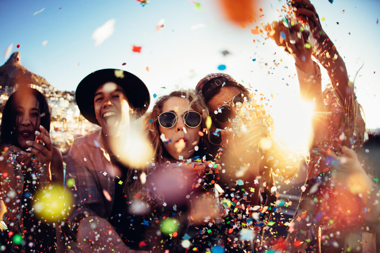Guests have fun at a party using clever theme party ideas.