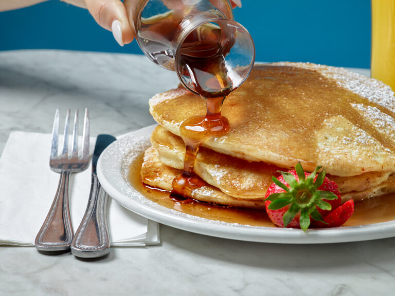 pancakes with syrup and strawberries