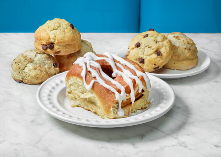 A cinnamon roll alongside pastries